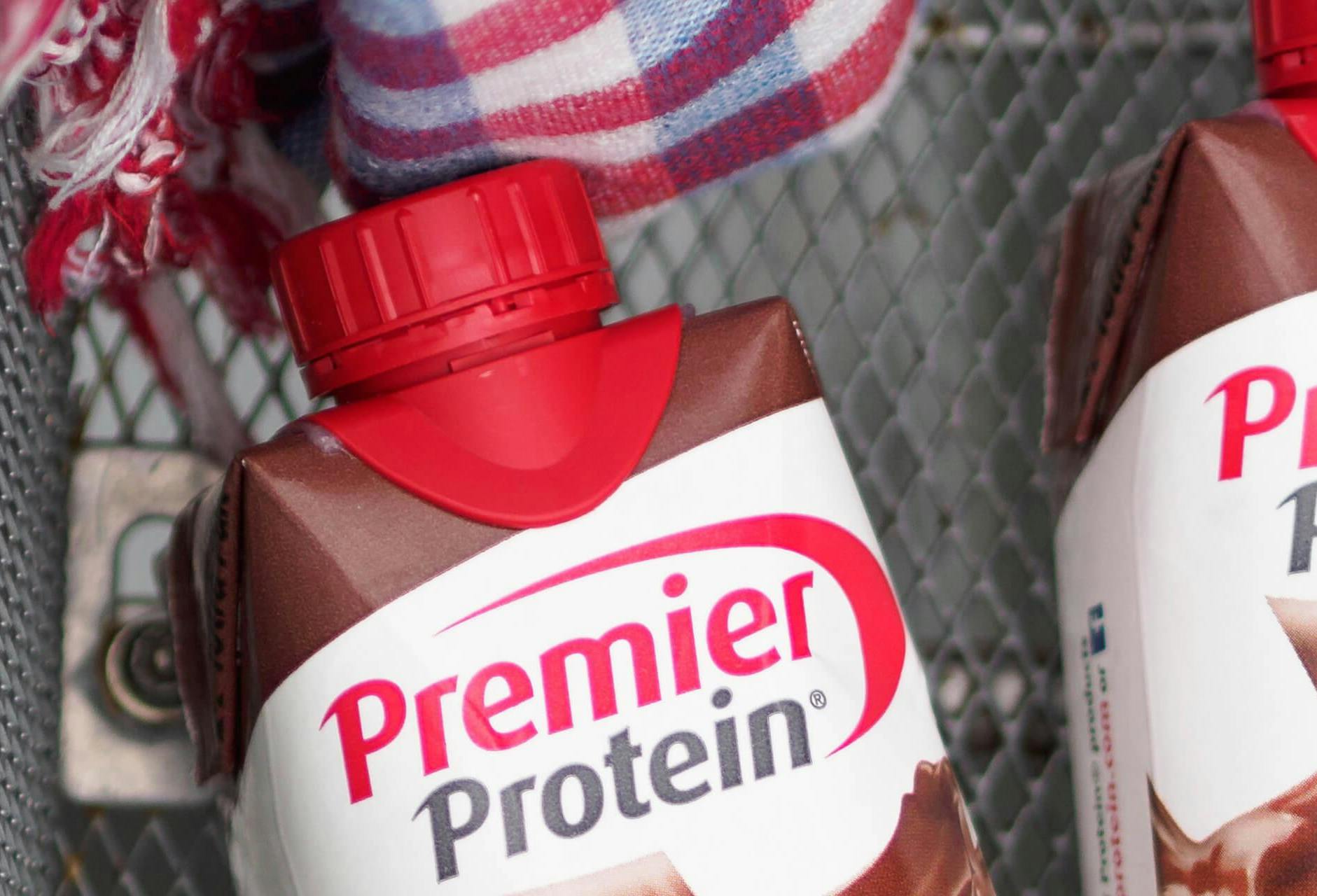 Two Premier Protein shakes in a locker.
